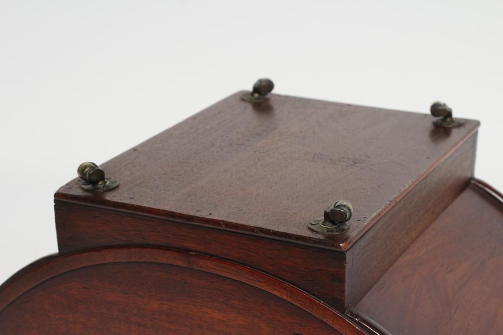 A REGENCY MAHOGANY CHEESE COASTER of typical dished form with centre division Image