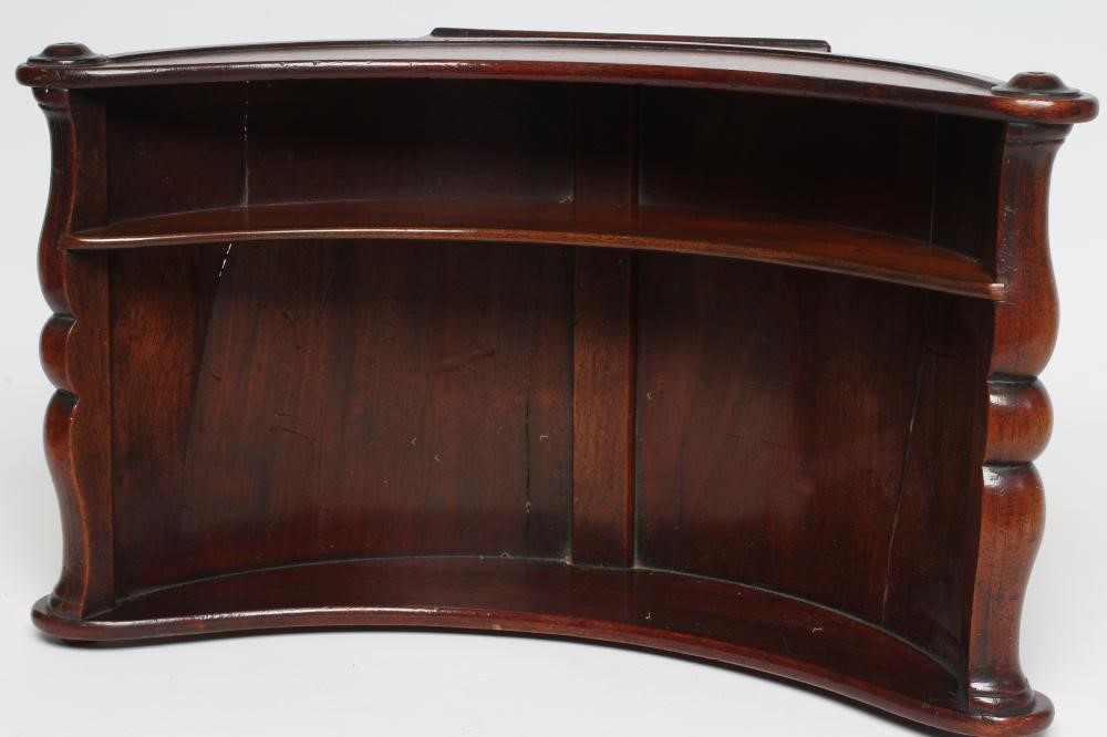 A REGENCY MAHOGANY CHEESE COASTER of typical dished form with centre division Image