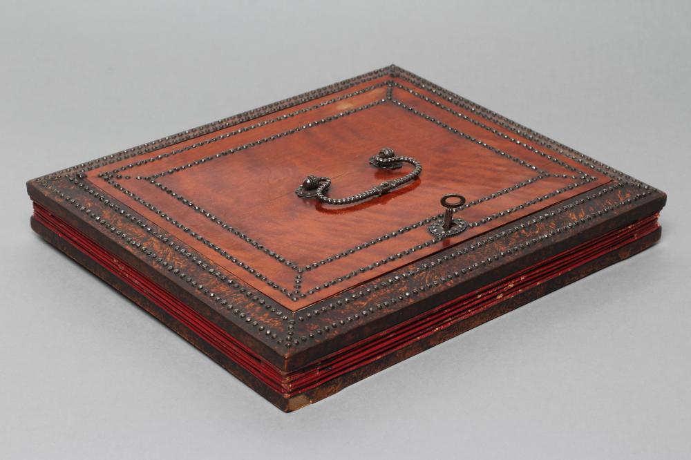 A VICTORIAN EXPANDING DAVENPORT BOX of oblong form with steel stud and painted faux burr wood Image