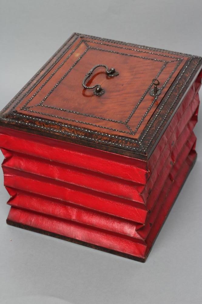 A VICTORIAN EXPANDING DAVENPORT BOX of oblong form with steel stud and painted faux burr wood Image