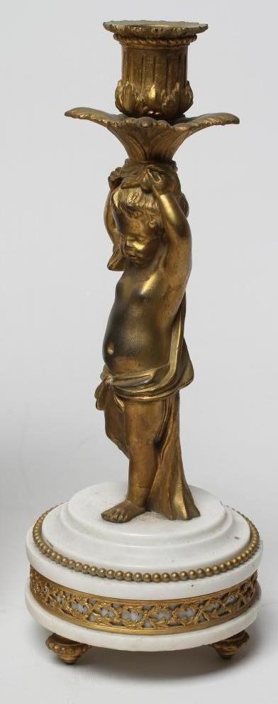 A FRENCH GILT METAL AND WHITE MARBLE CLOCK GARNITURE Image