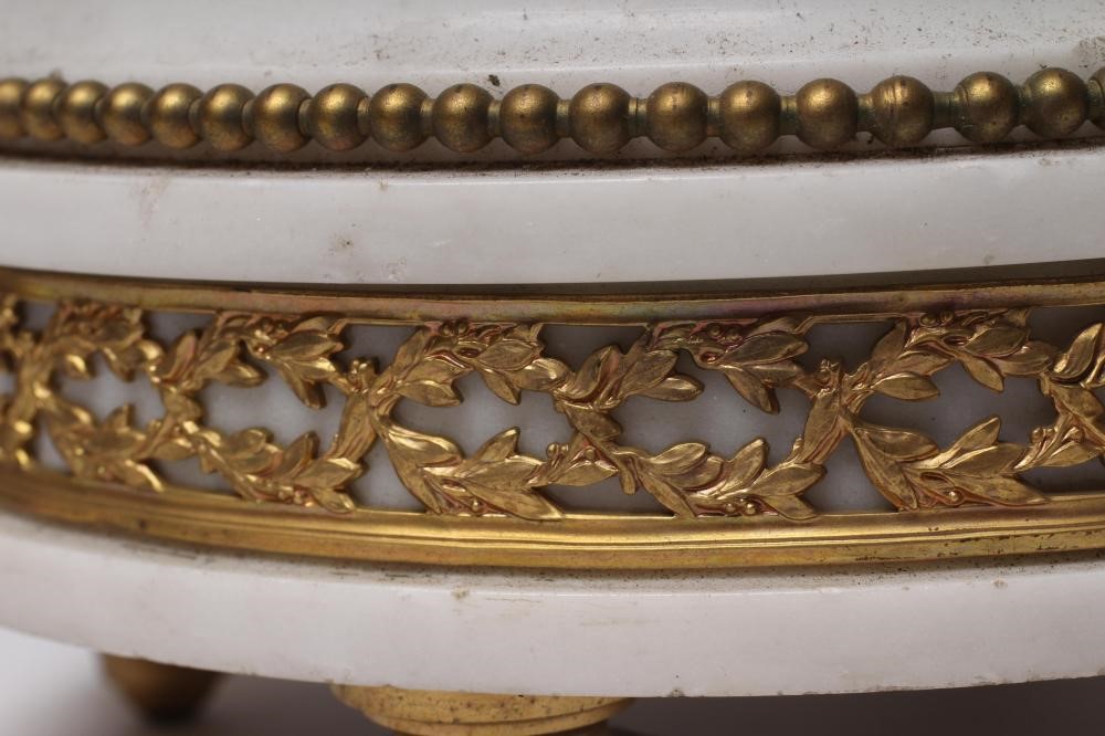A FRENCH GILT METAL AND WHITE MARBLE CLOCK GARNITURE Image