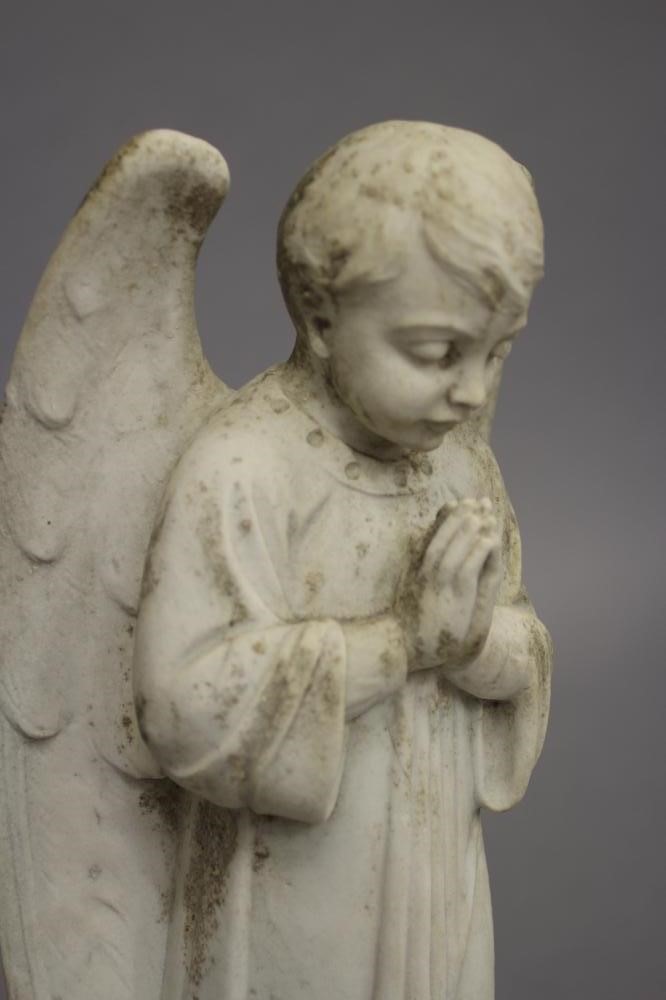 A CARVED WHITE MARBLE FIGURE OF AN ANGEL Image