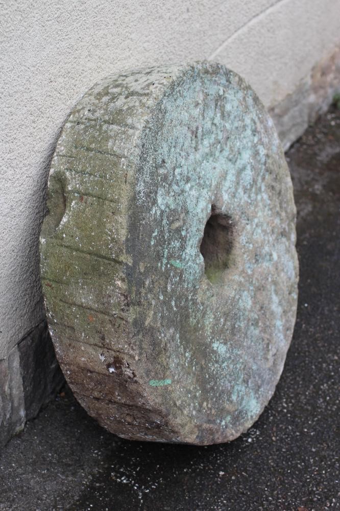 A SANDSTONE MILL WHEEL Image