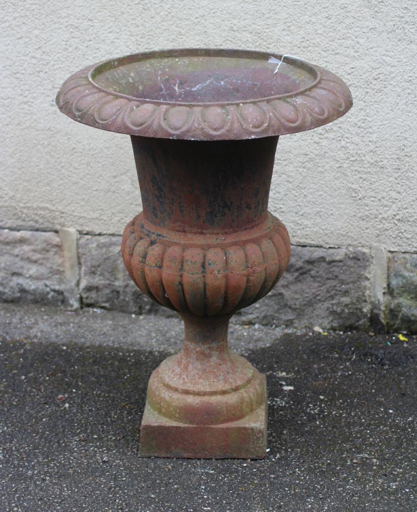 A VICTORIAN CAST IRON URN of half fluted campana form with ovolu rim Image