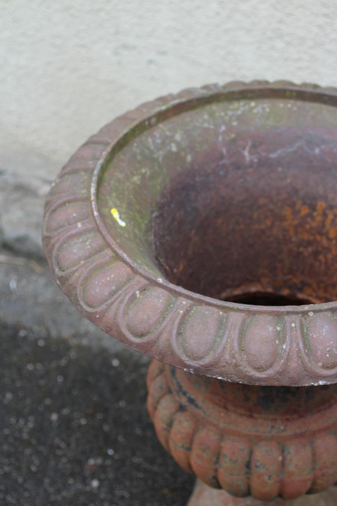 A VICTORIAN CAST IRON URN of half fluted campana form with ovolu rim Image