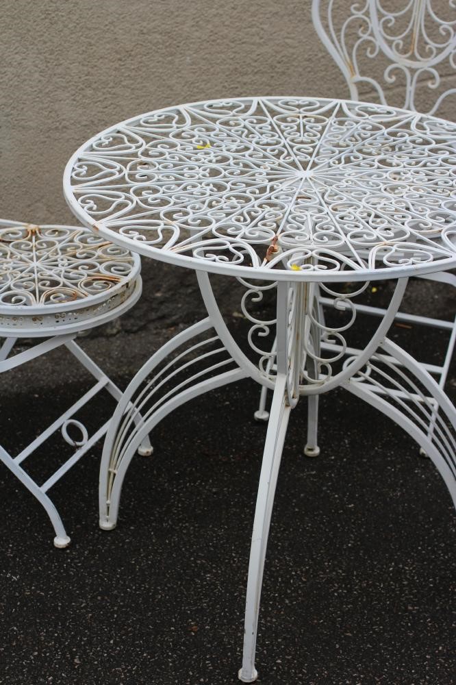 A CAST IRON FOLDING TABLE AND CHAIRS Image