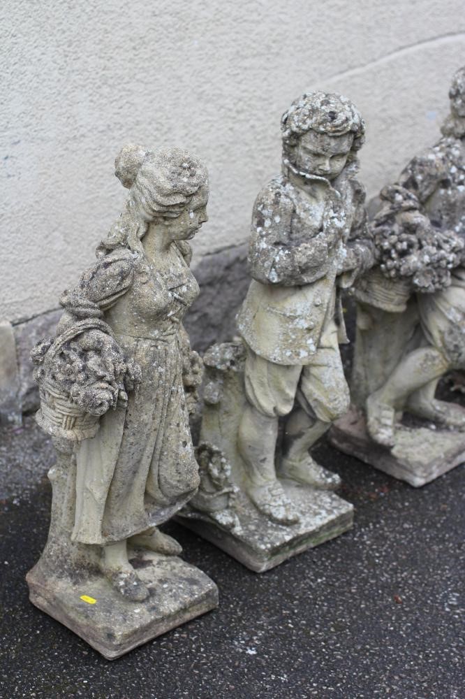 A SET OF FOUR COMPOSITION STONE FIGURES allegorical of the Seasons Image