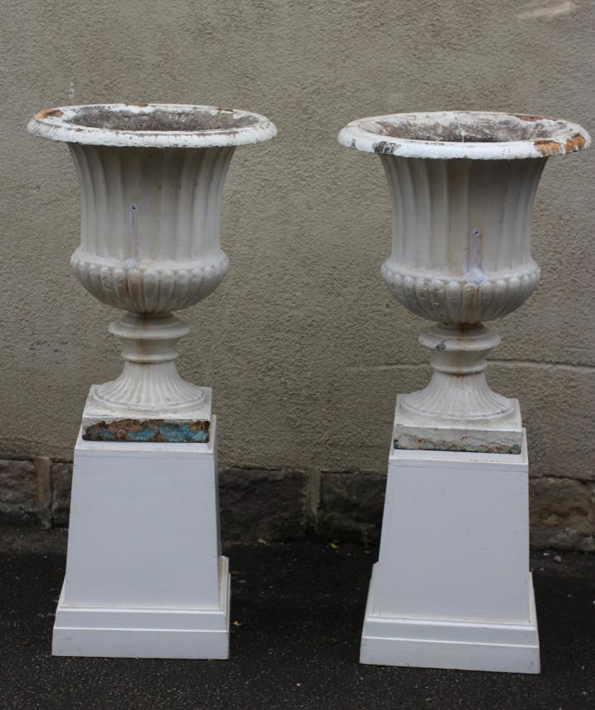 A PAIR OF LARGE VICTORIAN CAST IRON URNS Image