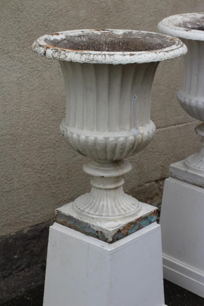 A PAIR OF LARGE VICTORIAN CAST IRON URNS Image