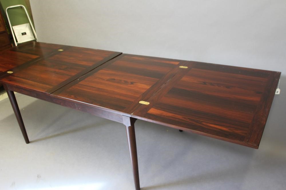 H.W.KLEIN FOR BRAMIN- A ROSEWOOD DINING TABLE AND CHAIRS Image