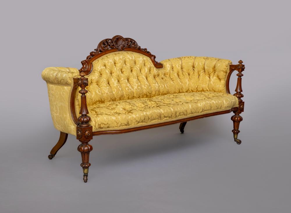 A VICTORIAN WALNUT SHOW FRAME SOFA of curved outline Image