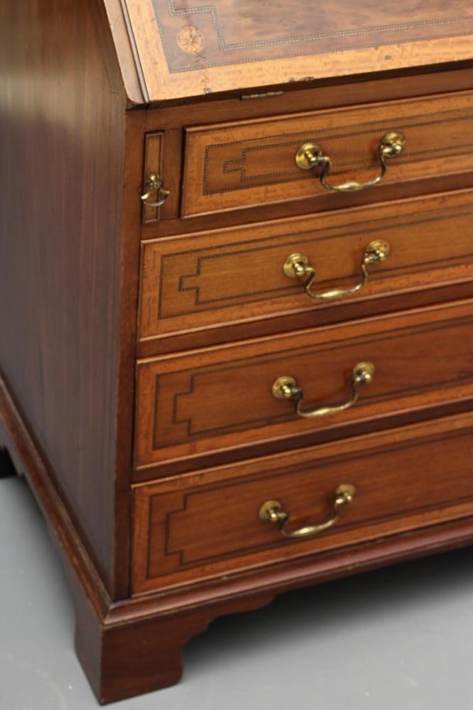 A MAHOGANY AND SATINWOOD BANDED BUREAU by Edwards & Roberts Image