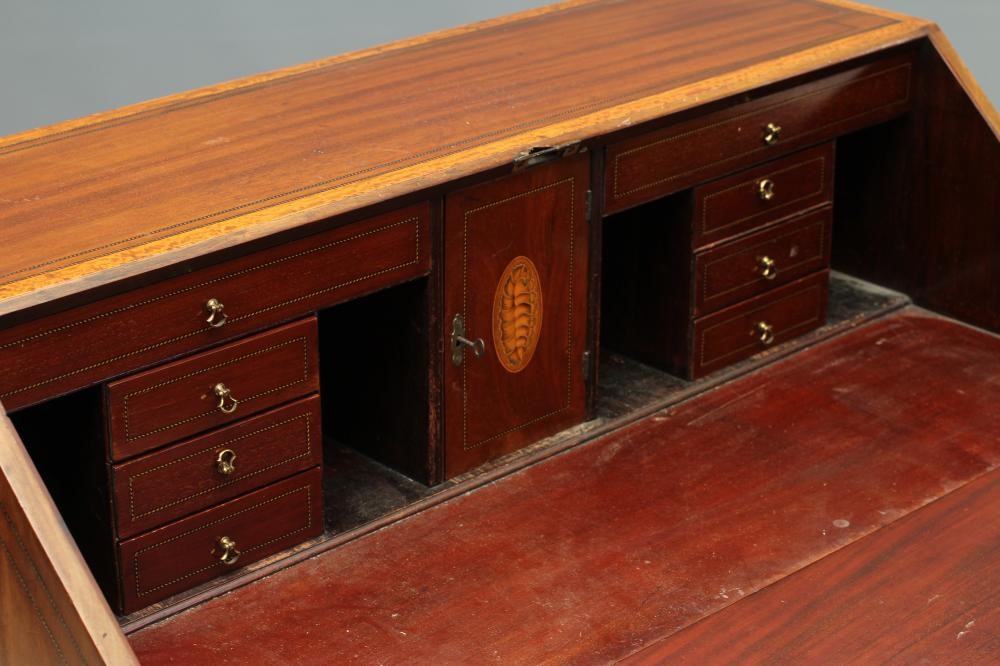 A MAHOGANY AND SATINWOOD BANDED BUREAU by Edwards & Roberts Image