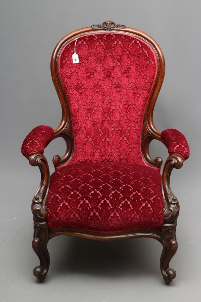 A VICTORIAN WALNUT SHOW FRAME EASY CHAIR of spoonback form button upholstered in crimson cut velvet Image
