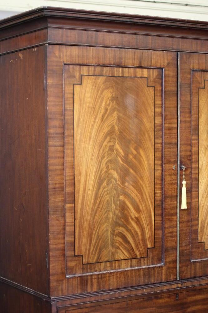 A REGENCY MAHOGANY AND EBONY STRUNG SECRETAIRE LINEN PRESS Image