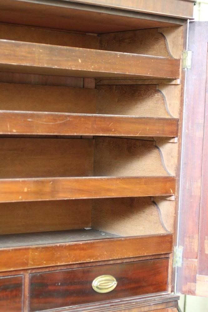 A REGENCY MAHOGANY AND EBONY STRUNG SECRETAIRE LINEN PRESS Image