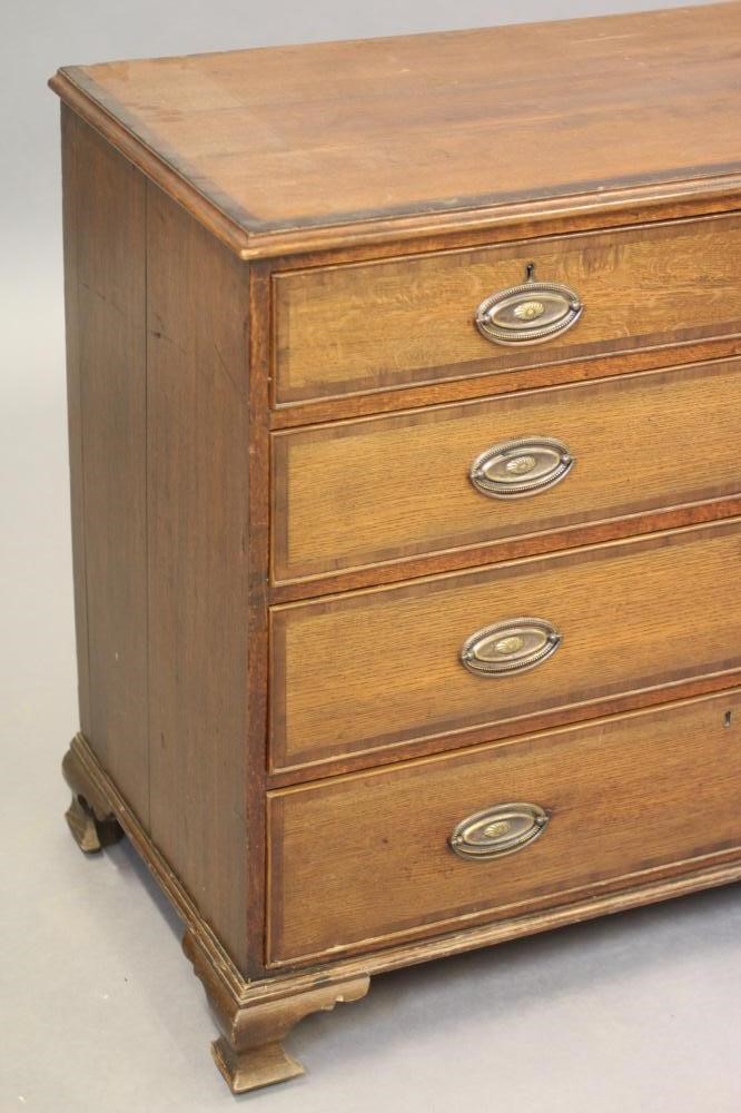 A GEORGIAN OAK AND MAHOGANY BANDED CHEST Image