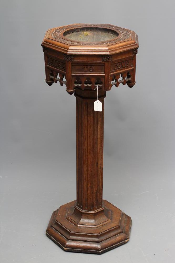 A VICTORIAN CARVED OAK PEDESTAL FONT of octagonal form Image