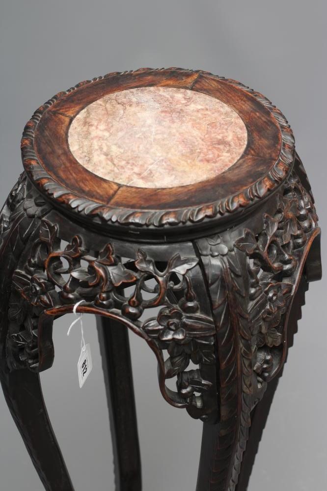 A CHINESE PADOUK WOOD JARDINIERE STAND Image