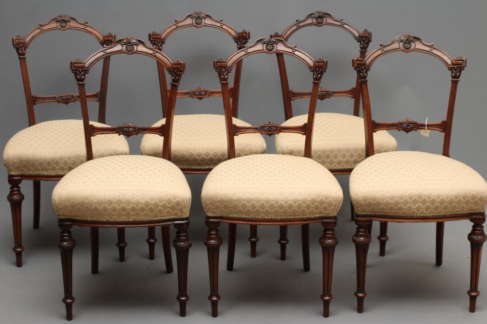 A SET OF SIX VICTORIAN WALNUT DINING CHAIRS upholstered in a cream and rust weave Image