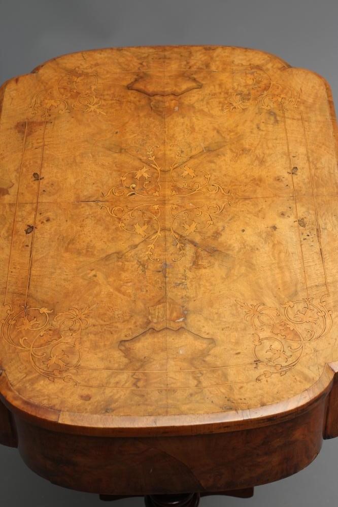 A VICTORIAN WALNUT AND MARQUETRY WORK TABLE of oblong form with rounded ends Image