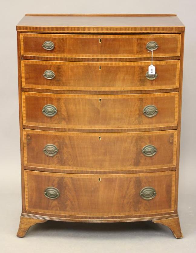 A MAHOGANY BOWED CHEST Image