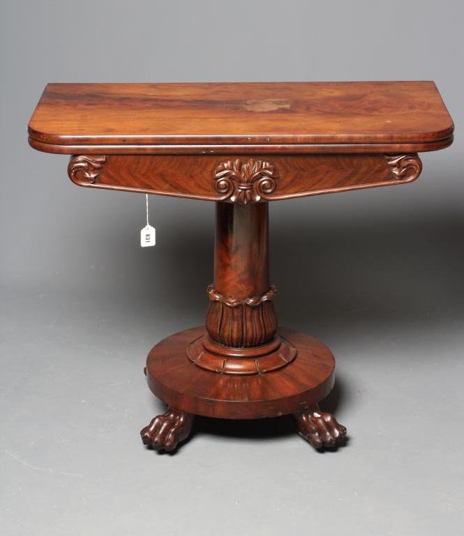 A VICTORIAN MAHOGANY FOLDING TEA TABLE of rounded oblong form with swivel top Image