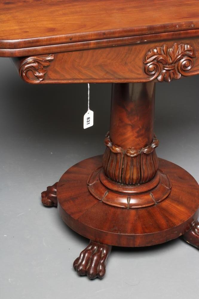 A VICTORIAN MAHOGANY FOLDING TEA TABLE of rounded oblong form with swivel top Image