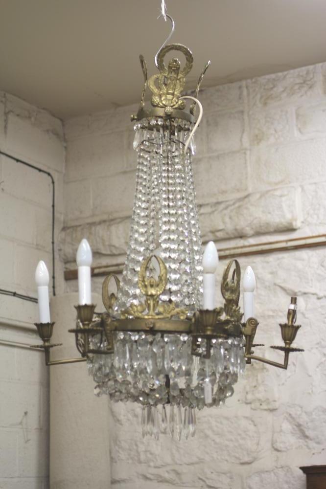 A GILT METAL AND GLASS BEAD CHANDELIER Image