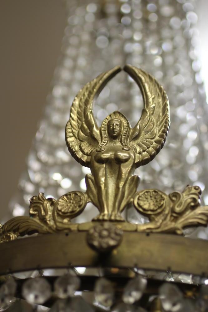 A GILT METAL AND GLASS BEAD CHANDELIER Image