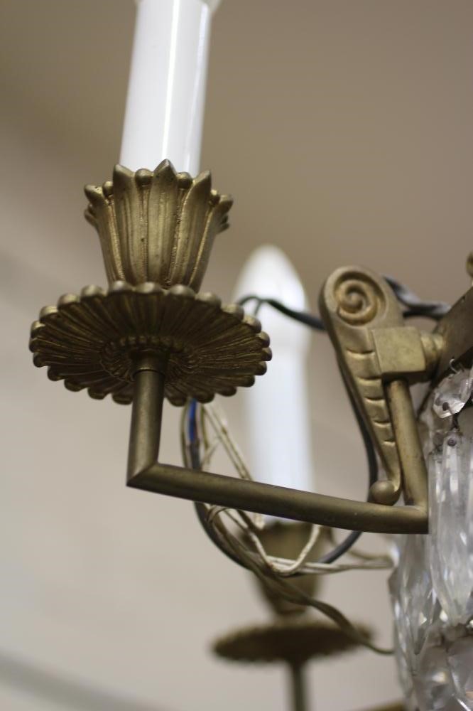 A GILT METAL AND GLASS BEAD CHANDELIER Image