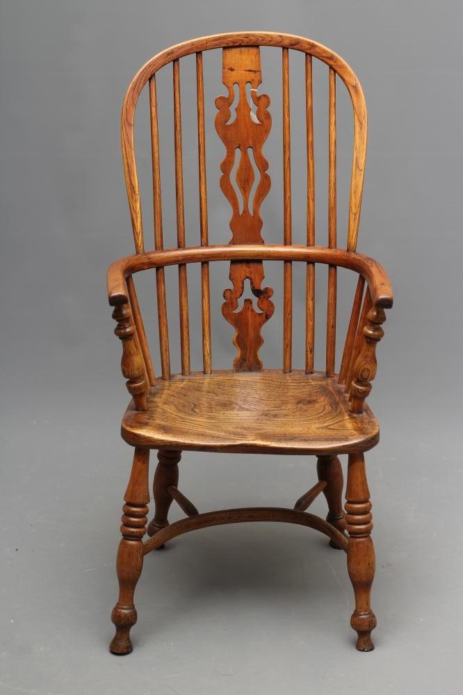 AN ASH AND ELM HIGH HOOP BACK WINDSOR ARMCHAIR Image