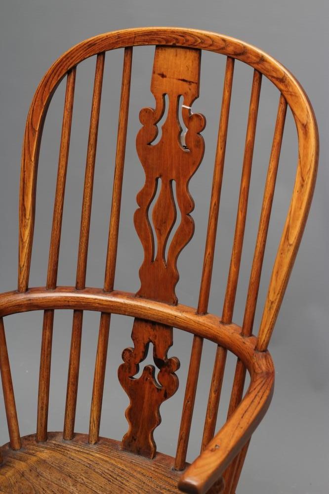 AN ASH AND ELM HIGH HOOP BACK WINDSOR ARMCHAIR Image