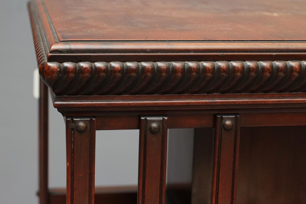 A LATE VICTORIAN MAHOGANY REVOLVING BOOKCASE of three tier square form with part slatted sides Image
