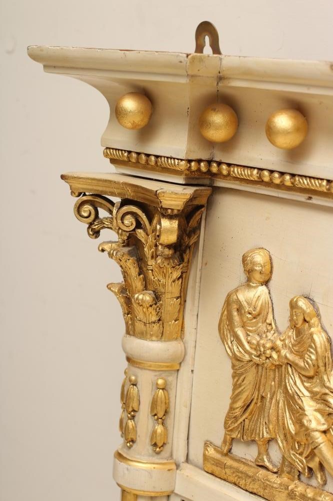A REGENCY PAINTED AND PARCEL GILT TRIPLE PLATE OVERMANTEL MIRROR Image