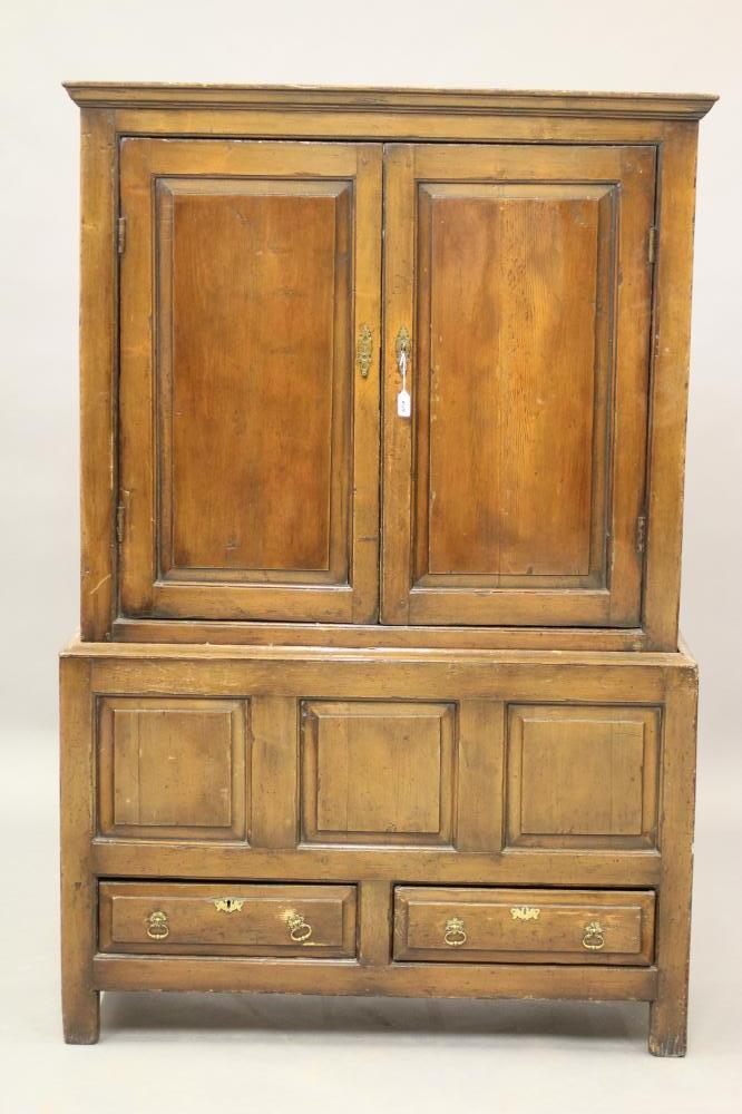 A GEORGIAN PINE PANELLED CLOTHES CUPBOARD Image