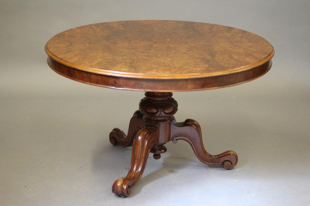 A VICTORIAN WALNUT CENTRE TABLE Image