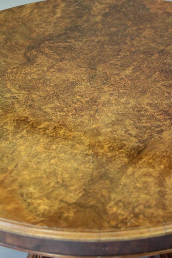 A VICTORIAN WALNUT CENTRE TABLE Image