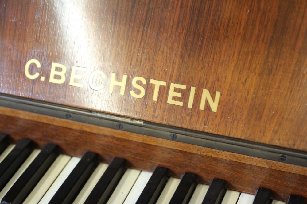 A ROSEWOOD CASED BECHSTEIN UPRIGHT PIANO Image