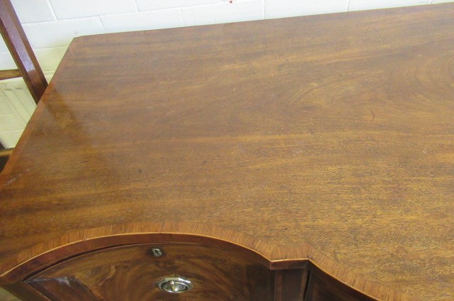 A GEORGIAN MAHOGANY SIDEBOARD Image