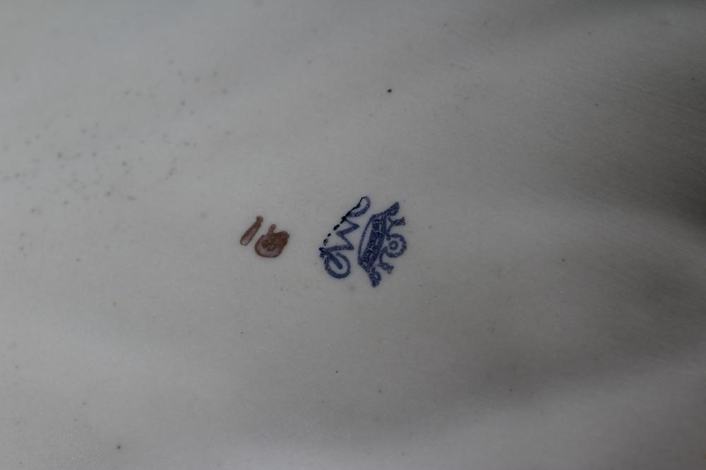 A CONTINENTAL PORCELAIN CENTRE DISH modelled as two maidens wearing flowing green and pink tinted Image