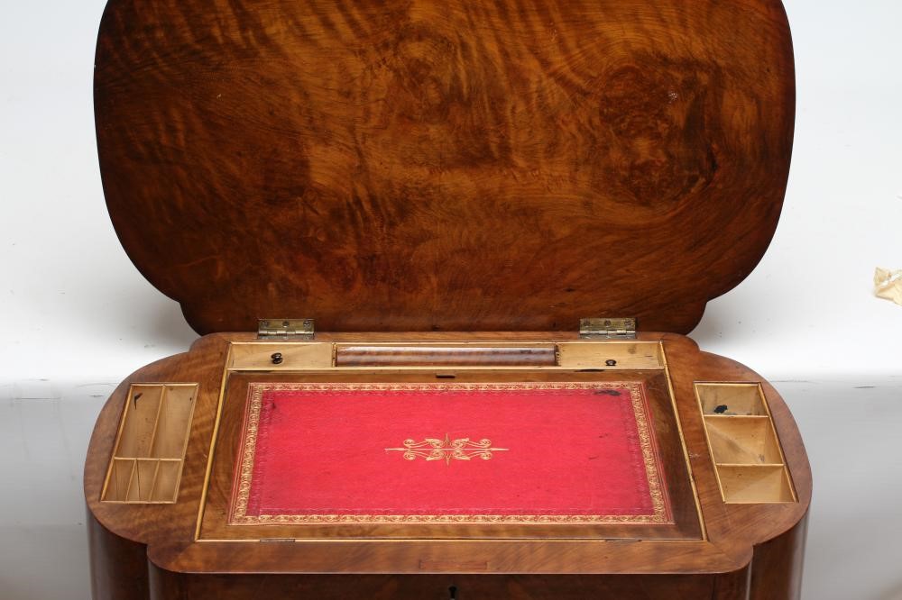 A VICTORIAN BURR WALNUT WORK/WRITING TABLE of oblong form with rounded ends Image