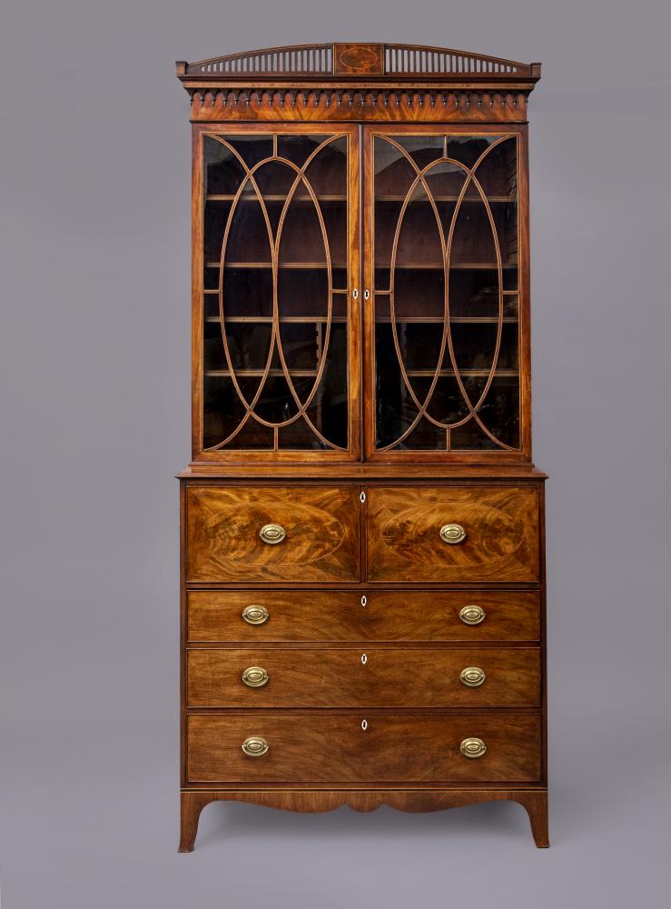 A REGENCY MAHOGANY SECRETAIRE CABINET with rosewood banding and stringing Image