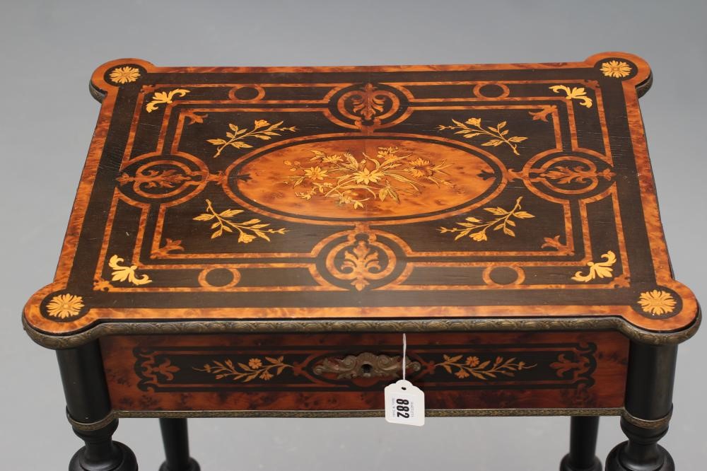 A VICTORIAN EBONISED AND YEW WOOD BANDED WORK TABLE of oblong form protruding corners and gilt metal Image