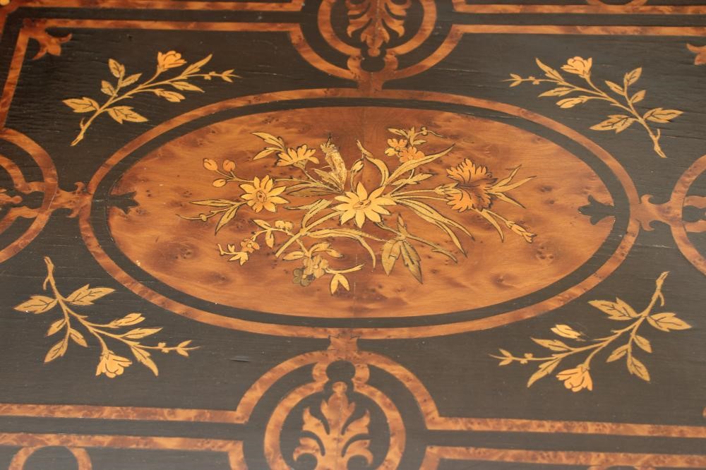 A VICTORIAN EBONISED AND YEW WOOD BANDED WORK TABLE of oblong form protruding corners and gilt metal Image