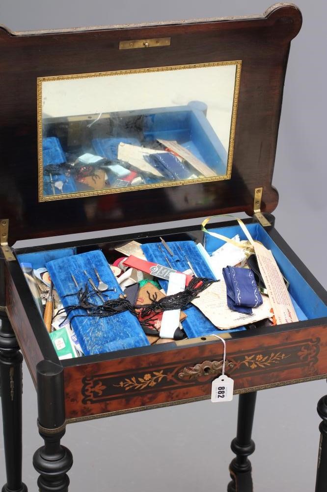 A VICTORIAN EBONISED AND YEW WOOD BANDED WORK TABLE of oblong form protruding corners and gilt metal Image