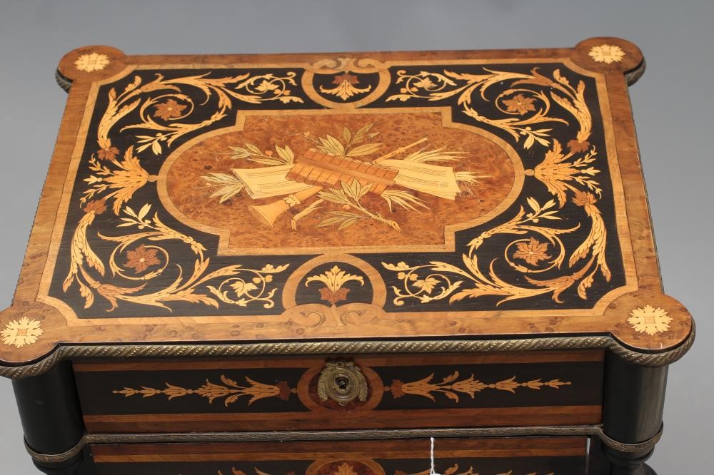 A VICTORIAN EBONISED YEW AND MARQUETRY WORK TABLE of oblong form with protruding corners and gilt Image