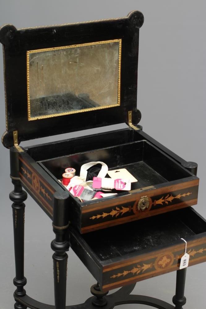 A VICTORIAN EBONISED YEW AND MARQUETRY WORK TABLE of oblong form with protruding corners and gilt Image