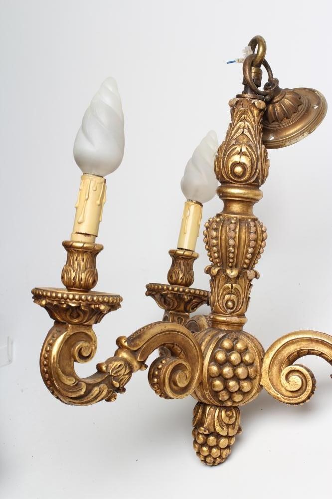 A PAIR OF CARVED GILT WOOD LIGHT PENDANTS Image